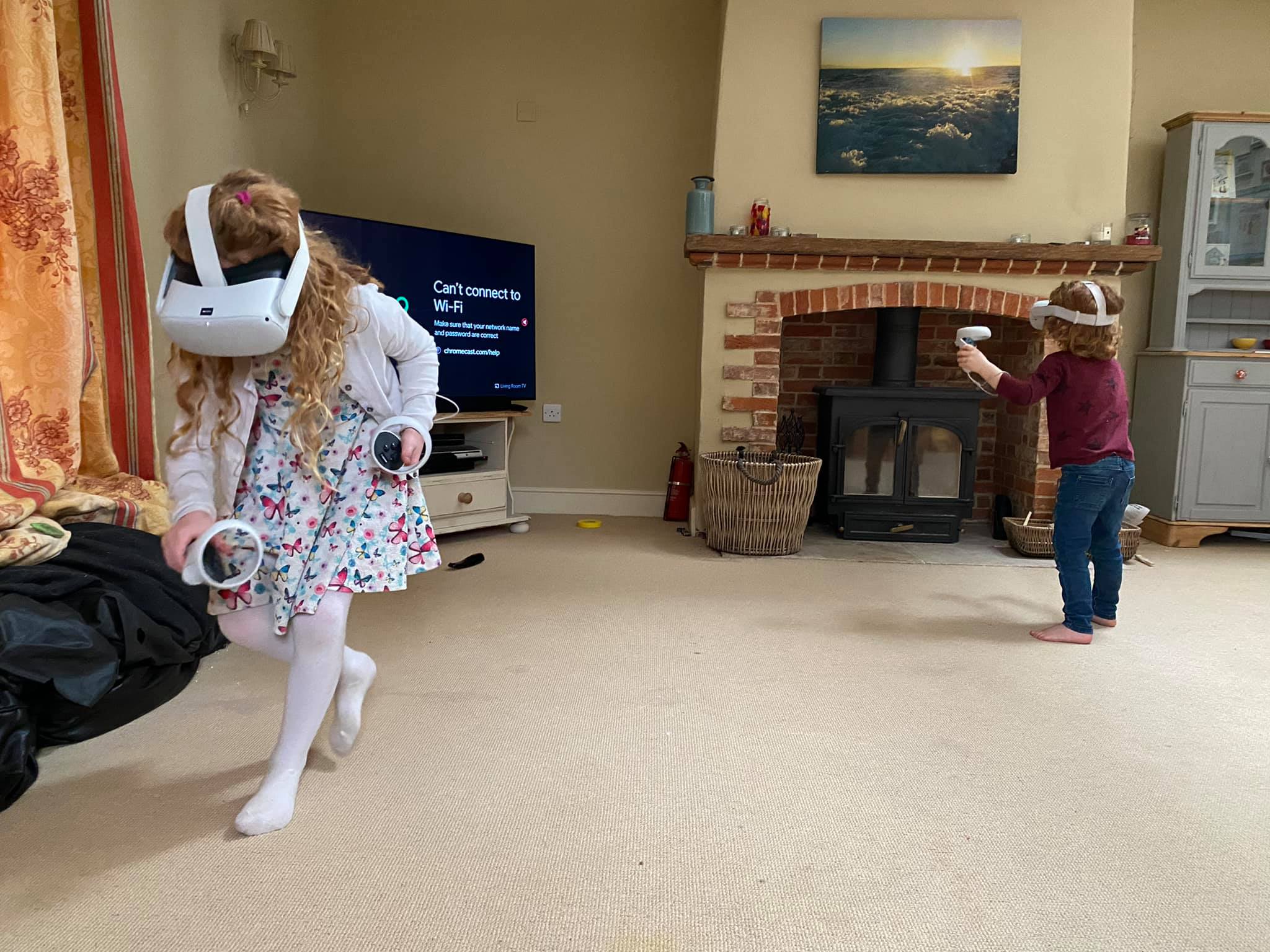 Small children having fun playing virtual reality.